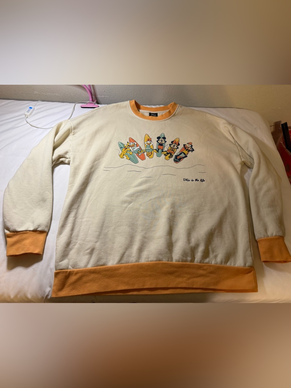 Disney Cream Sweatshirt with Orange Trim and Surf Character Graphic